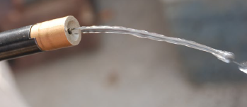 Water supply for CME button bit grinder