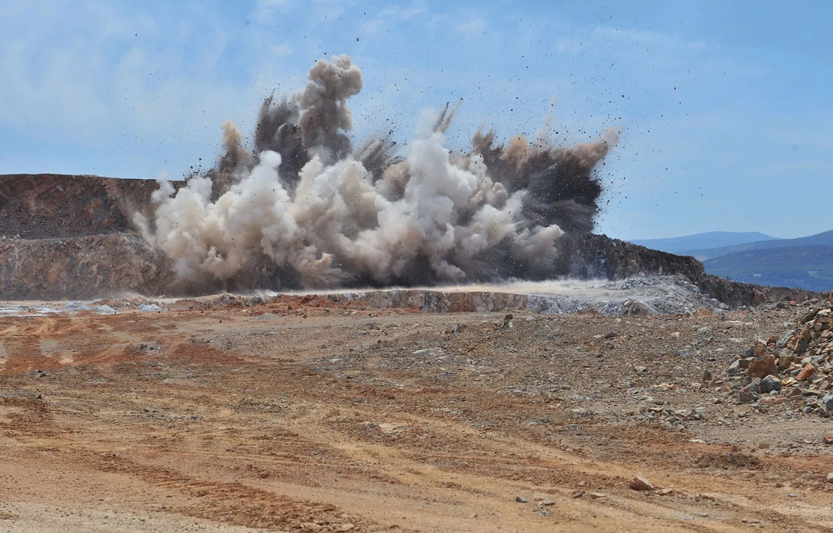  explosives to create a rapid expansion of gas that fractures rock or concrete