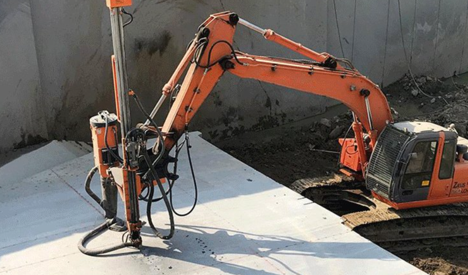 hammer drill to make holes in the rock or concrete